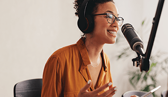 Woman speaking into microphone